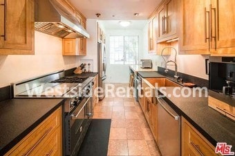 Building Photo - 10630 Eastborne Ave Unit 104