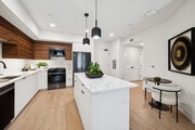 Stunning kitchen with pendant lighting - AMLI Aero