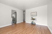 view of living room into kitchen which leads to the outside and master - 9211 Earl St House