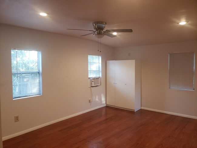Living space with wood-style flooring - 4966 Twining St