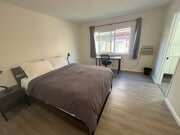 Primary Bedroom (queen bed, ensuite bathroom, walk in closet) - 1924 Park Grove Ave Apartments Unit 3