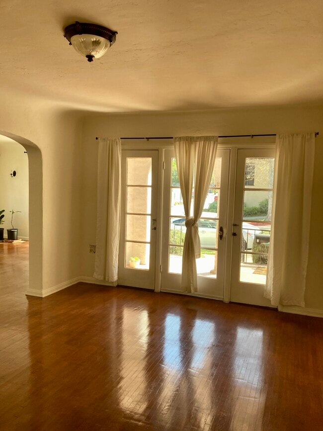 Dinning room. French doors exit to front porch - 2423 St George St Unit 2423