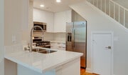 Spacious kitchens with wood flooring throughout - Hillcreste Apartment Homes