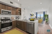 Open-Concept Kitchen, Dining, and Living Room Space with Patio - Cole Grove by Wiseman