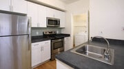 Kitchen with Stainless Steel Appliances - Sonterra at Foothill Ranch Apartments