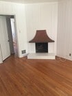 Beautiful Fireplace in den with book shelves - 3037 Motor Ave House