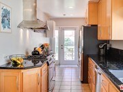 kitchen and laundry - 8037 Regis Way House