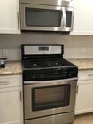 Stove - 8746 Reading Ave Apartments Unit 8746