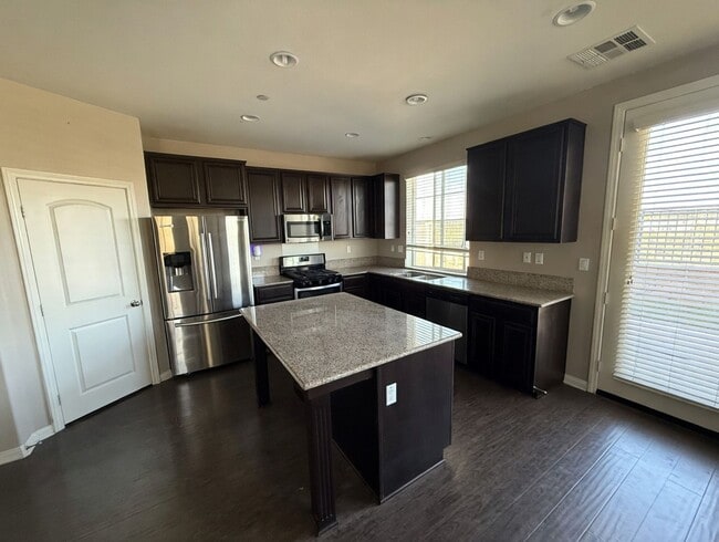 Photo - Charming 3BR Home with Modern Kitchen, Versatile Loft, & Private Backyard