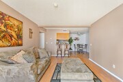 2BR, 2BA - 964SF - Living Room/Dining Room - Newporter Apartments