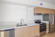 3BR, 2BA - 1,290SF - Kitchen - Woodlake Apartments