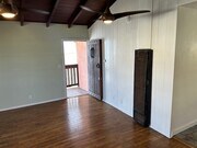 Living Room Looking at Front Door - 226 Palm Dr Apartments Unit Upper