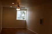 light and bright window with ceiling fan - 5935 Mildred Street Townhome