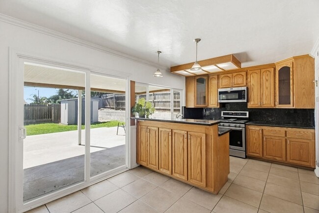 Photo - Single level, 4 bedroom, 2 bath home with 2 car garage and RV parking available now!