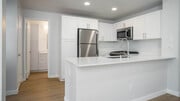 Kitchen with Stainless Steel Appliances - Vista Del Lago Apartments