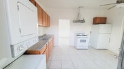 Remodeled kitchen with ceiling fan and natural light - 5527 Baileya Ave Unit A