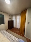 bedroom dresser and closet/ french doors to deck - 3219 McManus Ave House