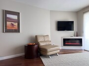 Electric fireplace and reading space for quiet reflection - 2035 4th St Condo Unit 303C