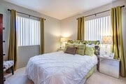 One furnished bedroom - High Desert Villas - 55+ Apartments