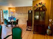 The living room lead into the dining room that looks onto the cascades of the backyard. - 11449 Woodbine St