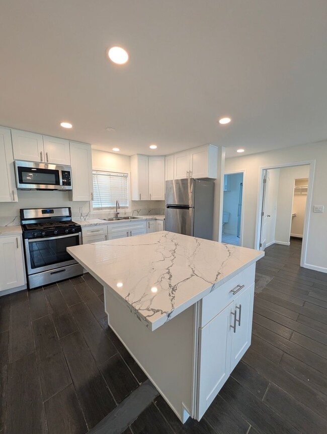 Building Photo - 5207-5209 Cartwright Ave. Unit 5207
