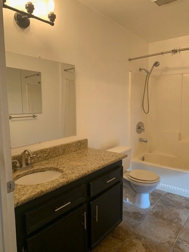 Photo - 1bd/1ba Lower, corner unit. Steps from BBQ area and laundry facilities.  Water/Sewer/Trash included! Unit 13