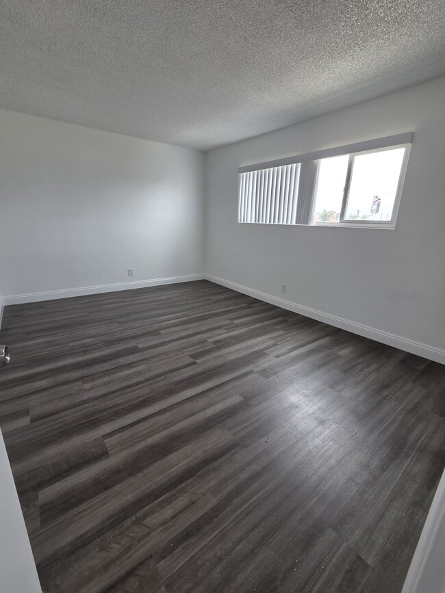 Bedroom with Luxury Vinyl Plank - 3455 Elm Ave Unit #307