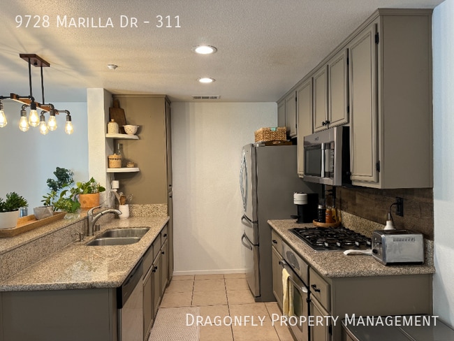 Building Photo - 9728 Marilla Dr Unit 311
