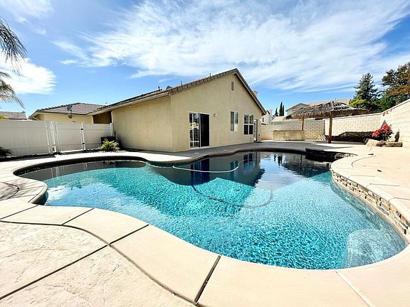 Photo - 3 Bed / 2 Bath Pool Home with Big Landscaped Yard & 3-Car Garage