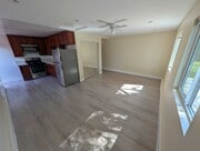 Living area with ceiling fan and mini-split AC - 6534 Peterson Ave