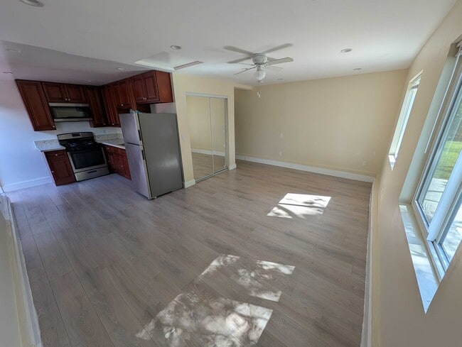 Living area with ceiling fan and mini-split AC - 6534 Peterson Ave