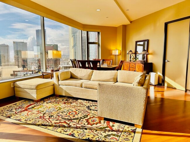 Living room w/ amazing skyline view - 801 S Grand Ave Condo Unit 2201