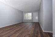Living room with hardwood flooring at Riverdale Apartment Homes in Hemet, California. - Riverdale Apartments