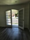 master suite arched french doors to balcony - 3663 Newton St Townhome