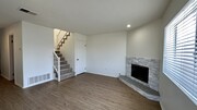 Living room with gas fireplace and deep storage/coat closet. - 939 Sapphire St Unit 939