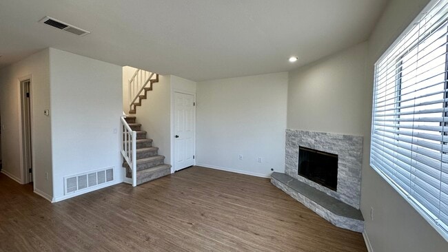 Living room with gas fireplace and deep storage/coat closet. - 939 Sapphire St Unit 939