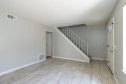 2BR, 1.5BA - 1,100SF - Living Room - Village Green