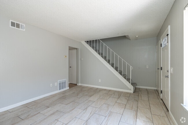 2BR, 1.5BA - 1,100SF - Living Room - Village Green