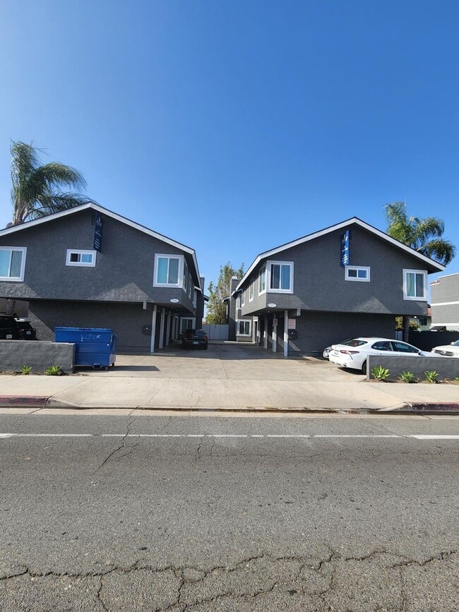 Building Photo - 7571-7571 Warner Ave Unit 7561-B