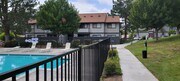 Dove Ridge scenic path by fenced pool area. - Dove Ridge Apartments