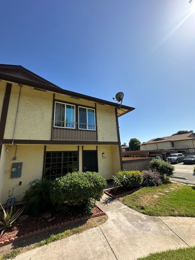 Photo - Spacious 3BR/2.5BA updated 2-story townhouse for rent with fenced patio, 2 parking spaces and more Unit A