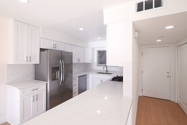 Photo - IN-UNIT LAUNDRY WITH ON-SITE PARKING!! Unit 104