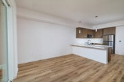 Elegant dining transitions flow naturally into a chef-ready kitchen designed for entertaining. - textur Apartments