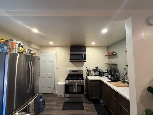 Kitchen includes stainless steel appliances w/ granite counter tops - 18173 Brightman Ave