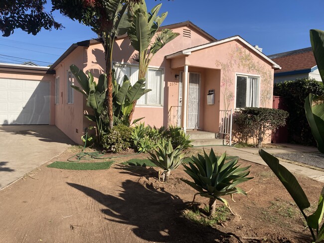 Two bedroom cute house with one car garage and one parking space available now. - 2052 Reed Ave House