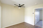 Dining room areas showing ceiling fan - Benchmark Apartments
