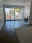 Hardwood Floors and new tile fireplace - 5039 E Ocean Blvd Apartments Unit 9