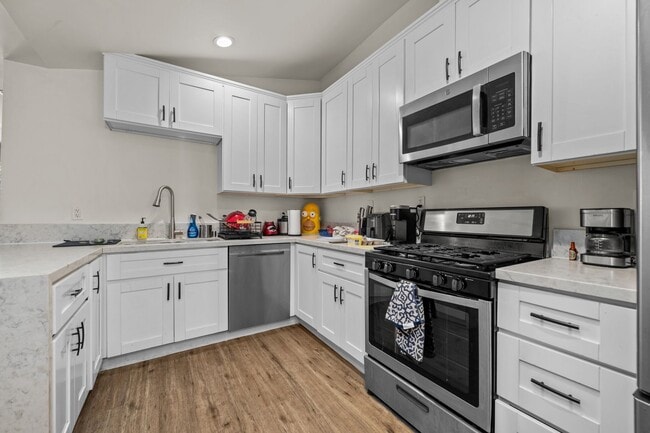 Photo - Two full kitchens + two washers & dryers!