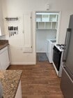 Kitchen and private laundry room - 5981 Guthrie Ave Unit #1
