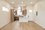 Brand new kitchen- European cabinets, quartz cabinets & backsplash, bar seating - 4772 Bancroft St Townhome